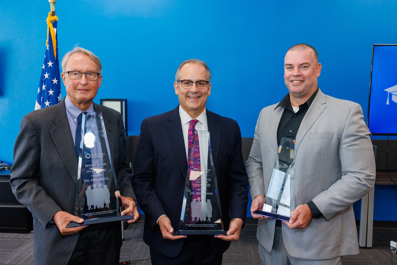 From left, Dr. Eric Smith, Dr. Jesus F. Jara and CCSD Adult Education Director Eric Gant display their awards. 