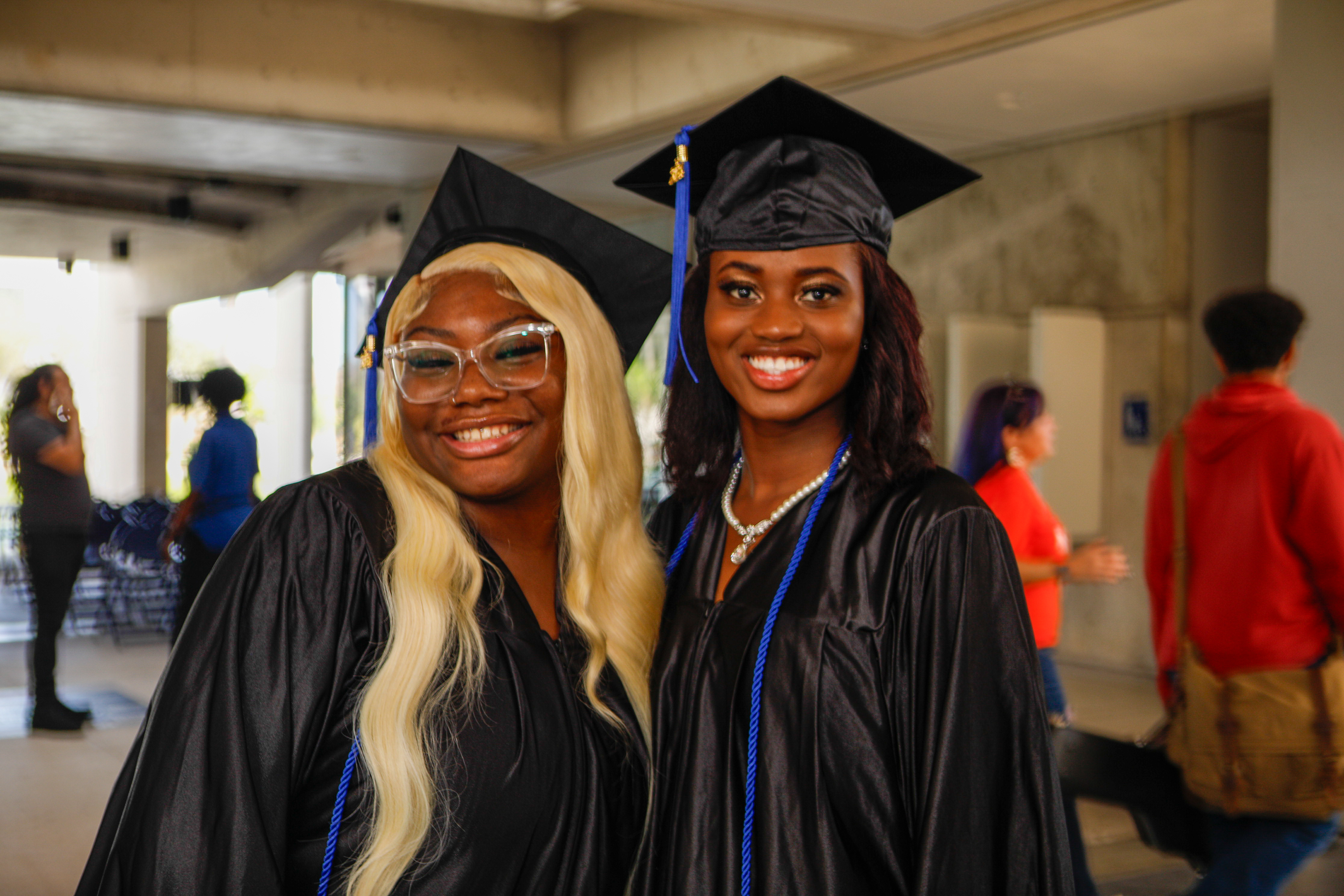 Two female high school graduates at Acceleration Academies.